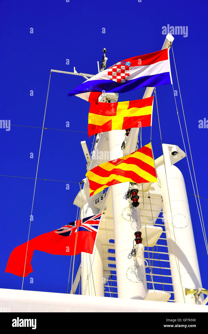 Red ensign Croatian flag and yellow red flags in Hvar Stock Photo