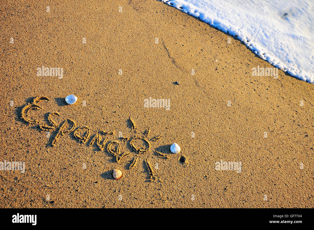 Spain sign on the sand beach Stock Photo