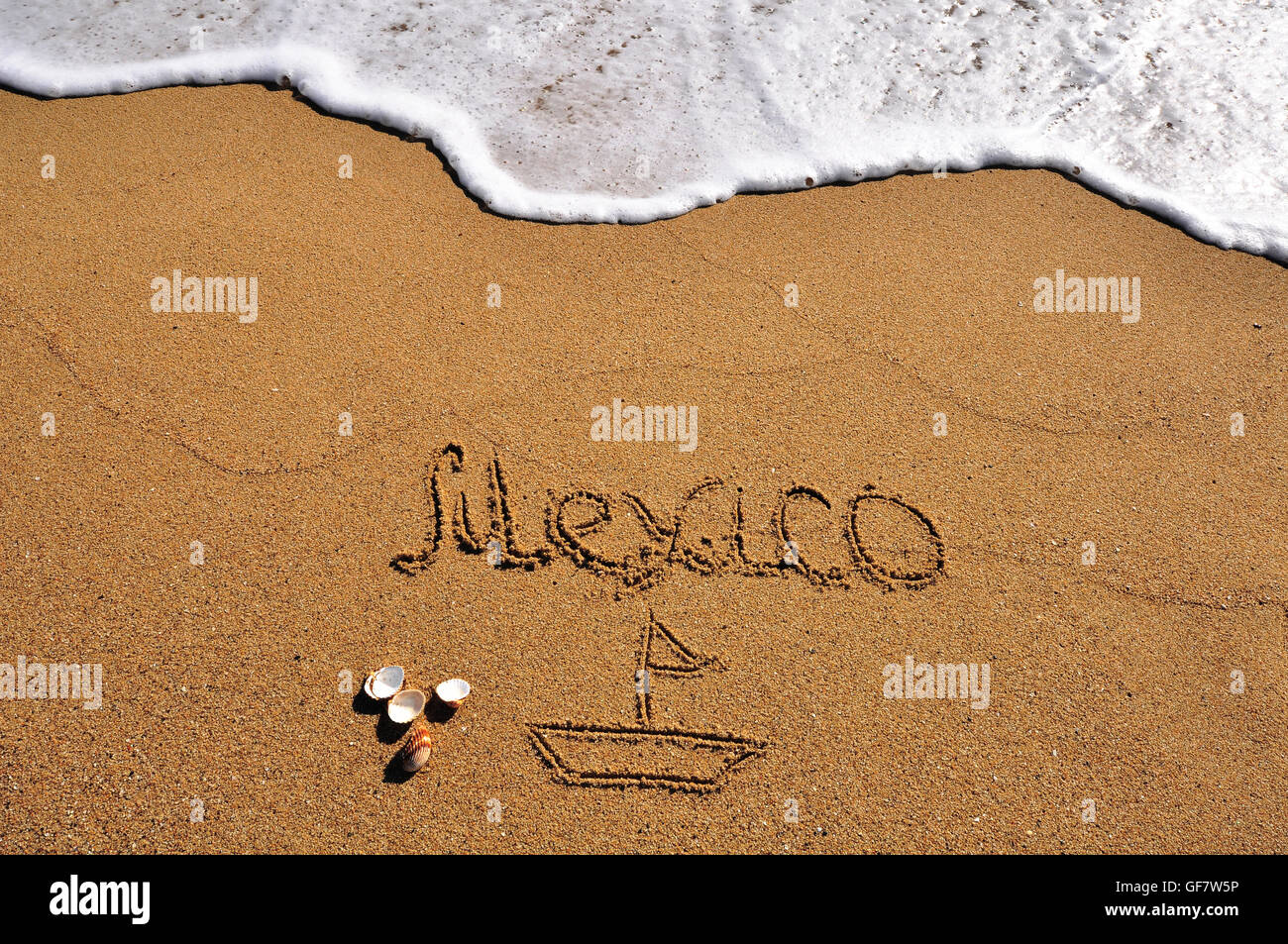 Mexico sign in the sand beach Stock Photo