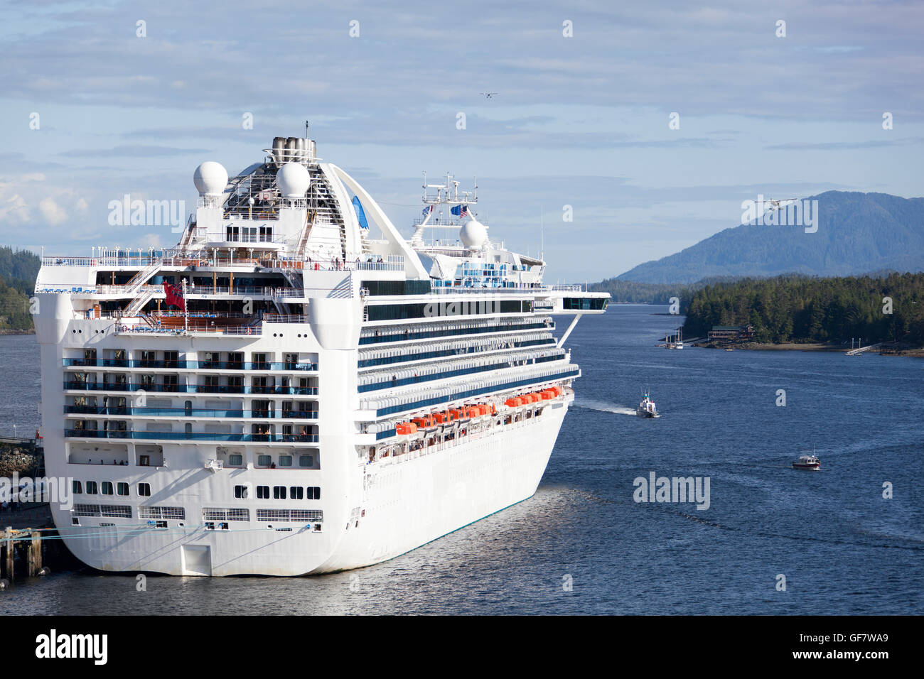 Planes and small boats passing by the docked cruise ship in Ketchikan (Alaska). Stock Photo