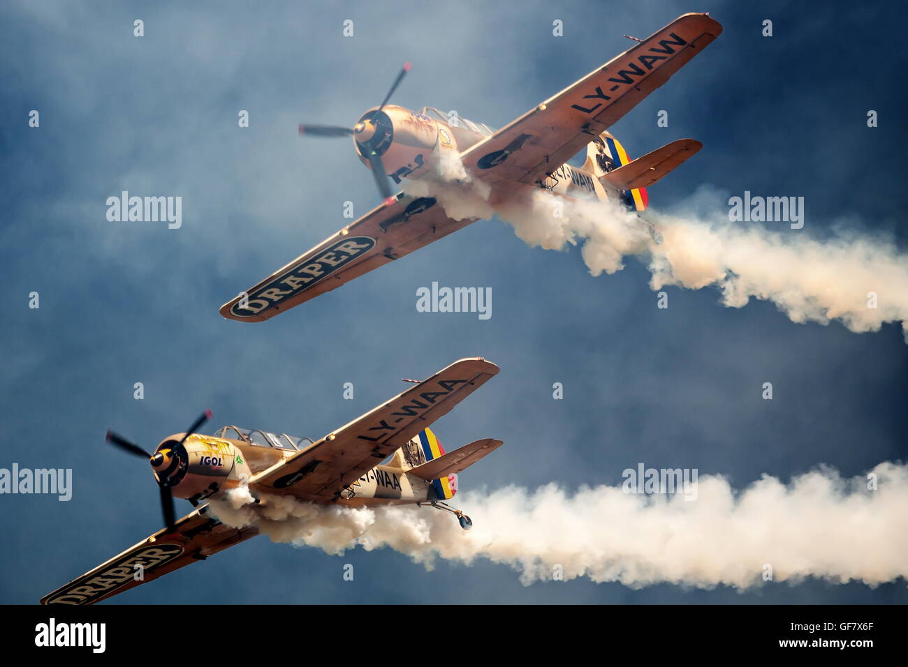 ROMANIA - JULY 23 Two unidentified vintage monoplane aircraft flying in formation at an air show on July 23, 2016 Campia Turzii Stock Photo