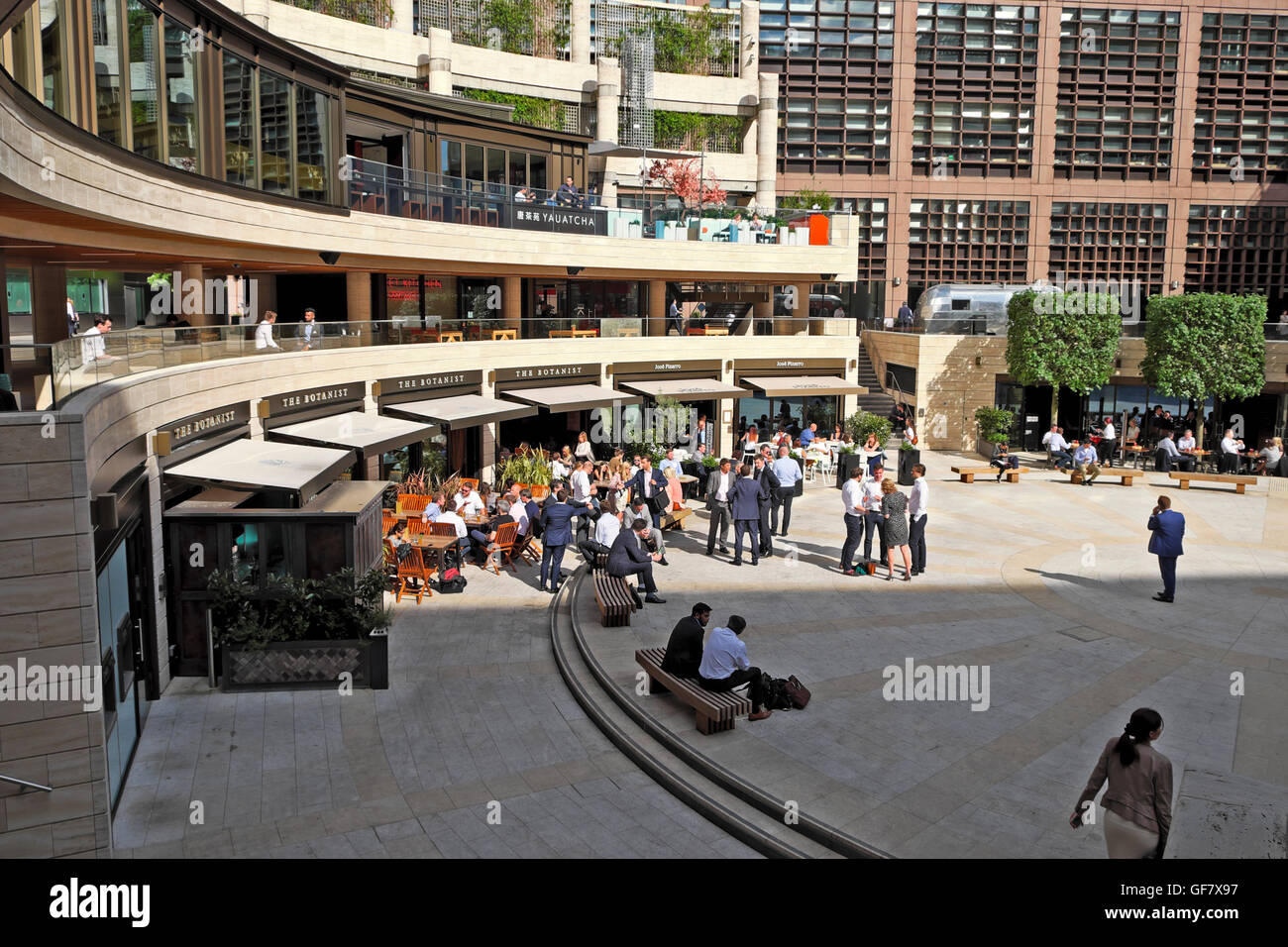 Business people having a drink after work outside The Botanist restaurant in Broadgate Circle City of London UK   KATHY DEWITT Stock Photo