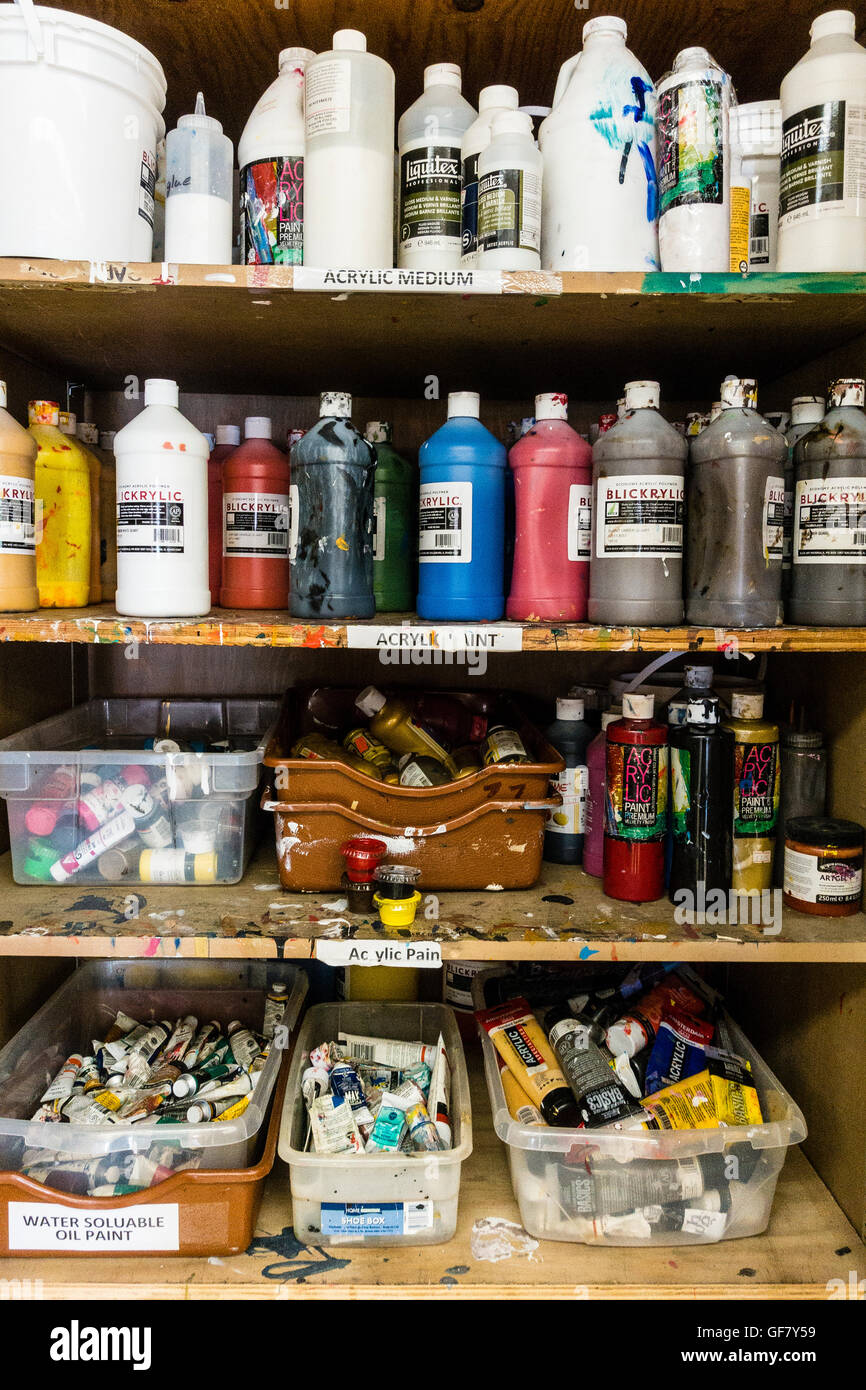 Inside of an artist storage cabinet with a variety of oil and acrylic  paints in an artist's studio Stock Photo - Alamy