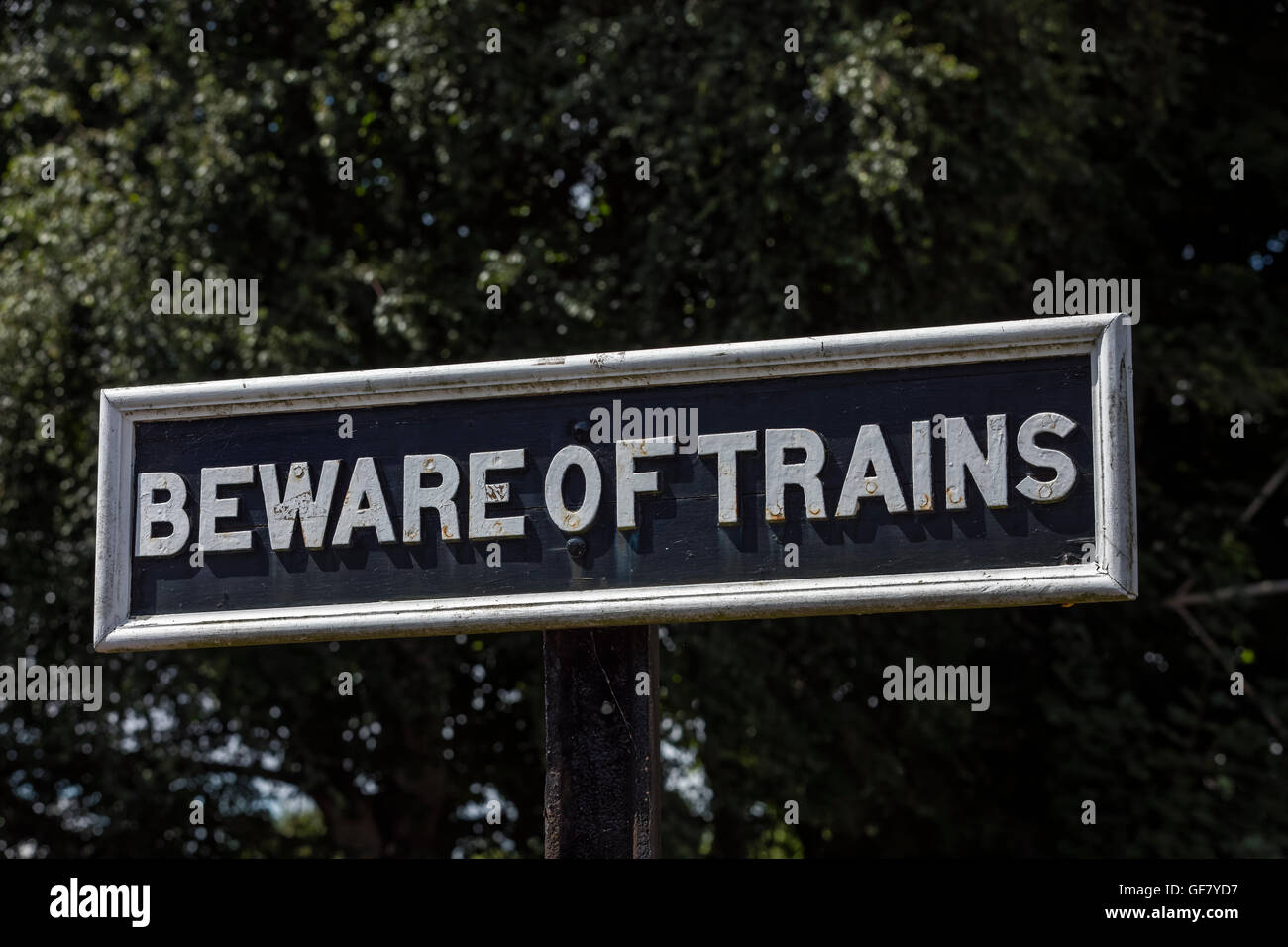 Beware of Trains sign at the Didcot Railway Centre in Oxfordshire England Stock Photo