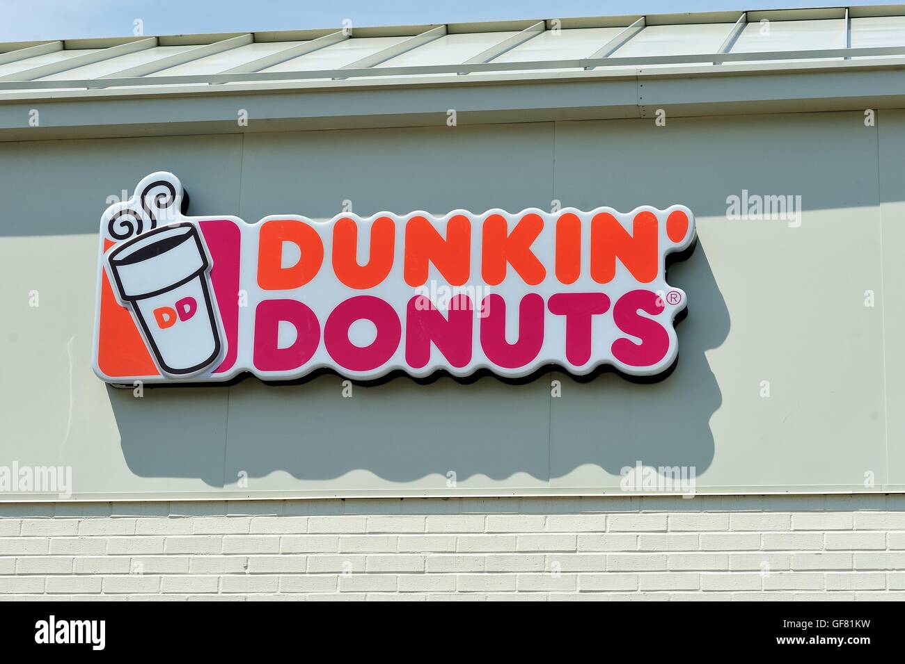 Recognizable national and regional brand locations abound in urban areas such as this Dunkin' Donuts sign. Bartlett, Illinois, USA. Stock Photo