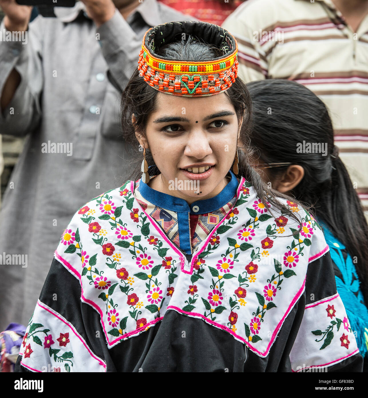 Pakistani woman wearing a traditional in a Kalash dress and headdress Stock Photo