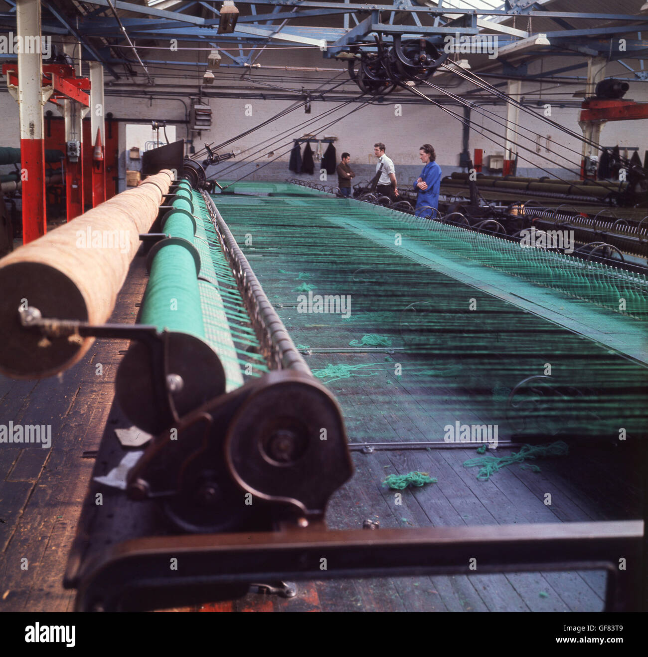 1960s, historical picture showing the large industrial spinning machines that manufacture Harris Tweed, Stornoway, Isle of Lewis, Highlands, Scotland. Stock Photo