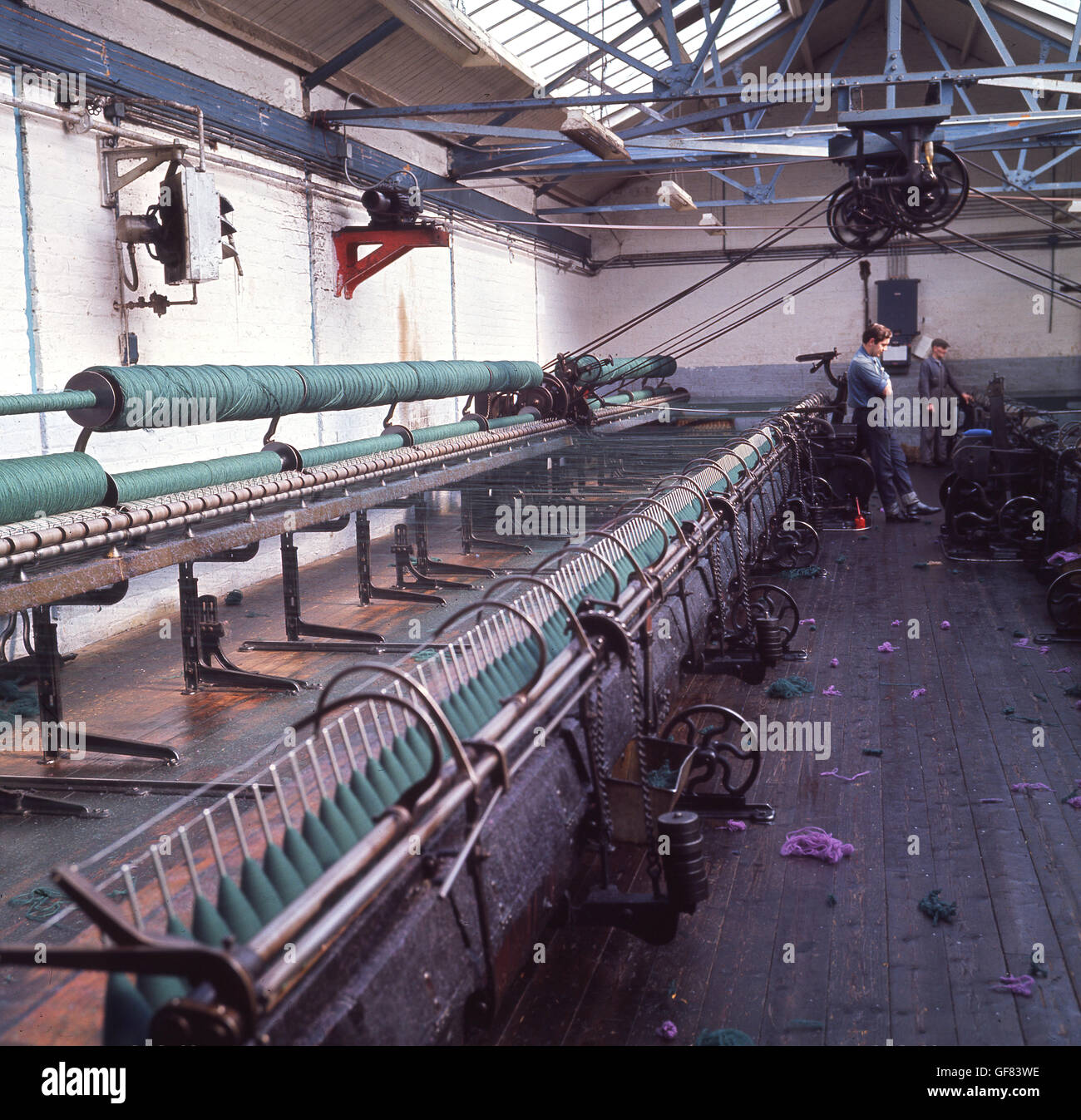 1960s, historical picture showing the large industrial spinning machines that manufacture Harris Tweed, Stornoway, Isle of Lewis, Highlands, Scotland. Stock Photo