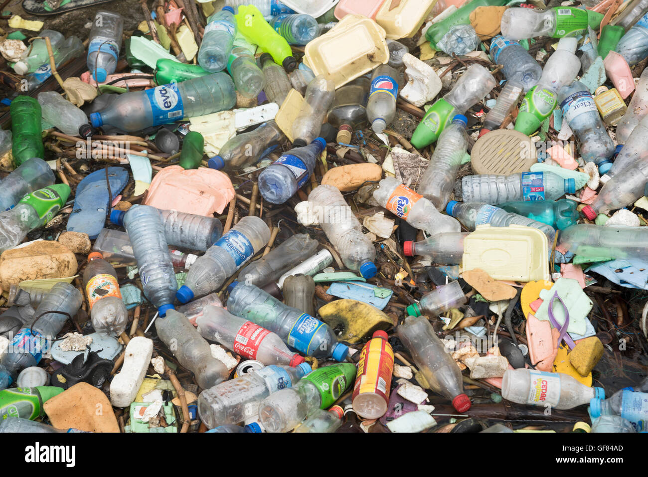 Rubbish and plastic waste flotsam pollution in Lagos creek, Nigeria, Africa Stock Photo