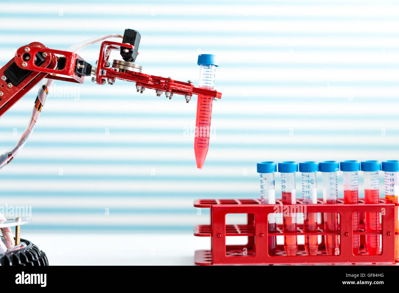 robot manipulates test tubes with dangerous chemicals Stock Photo