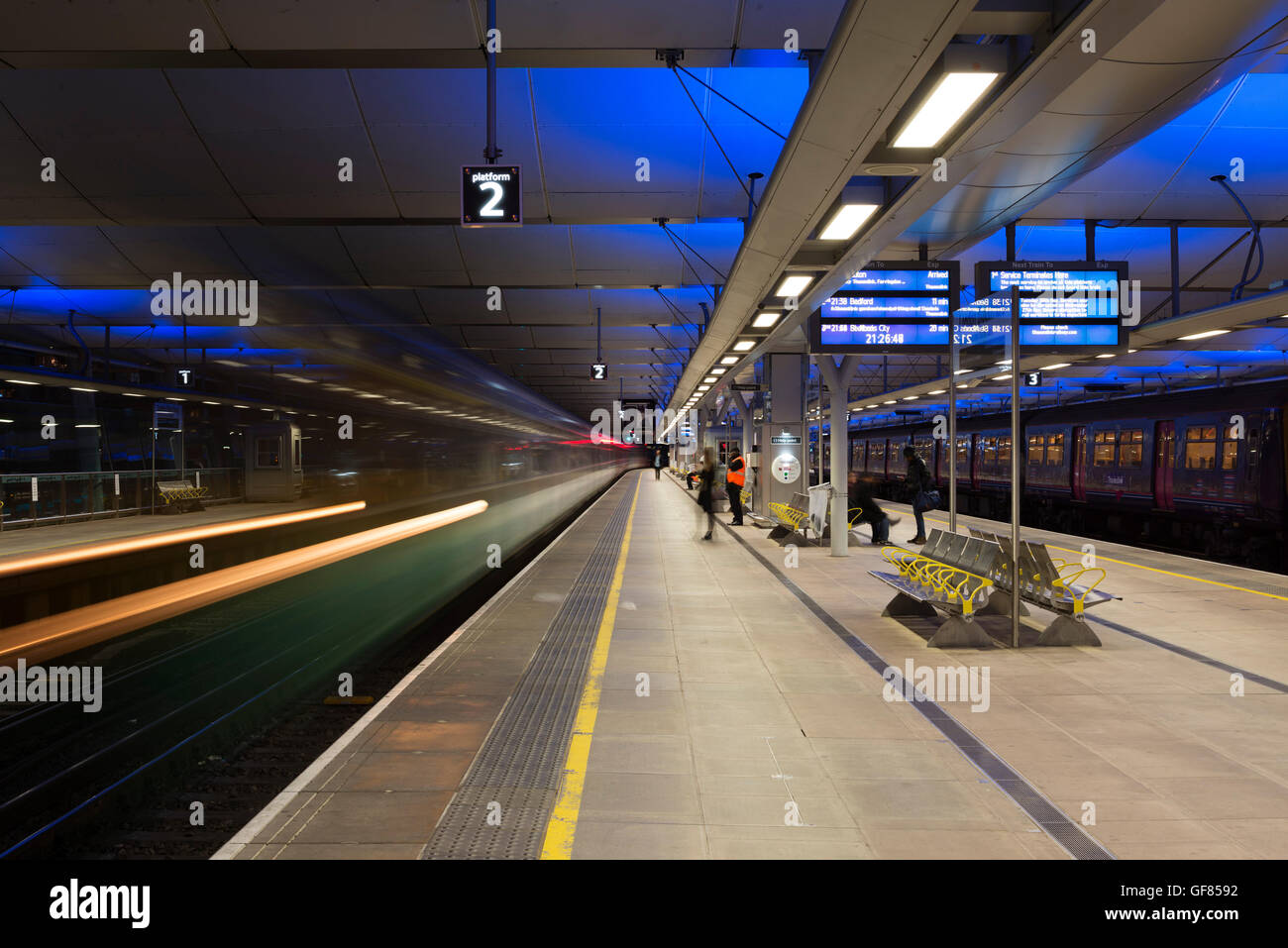 View along platform with train. Blackfriars Station, London, United Kingdom. Architect: Pascall+Watson architects Ltd, 2012. Stock Photo