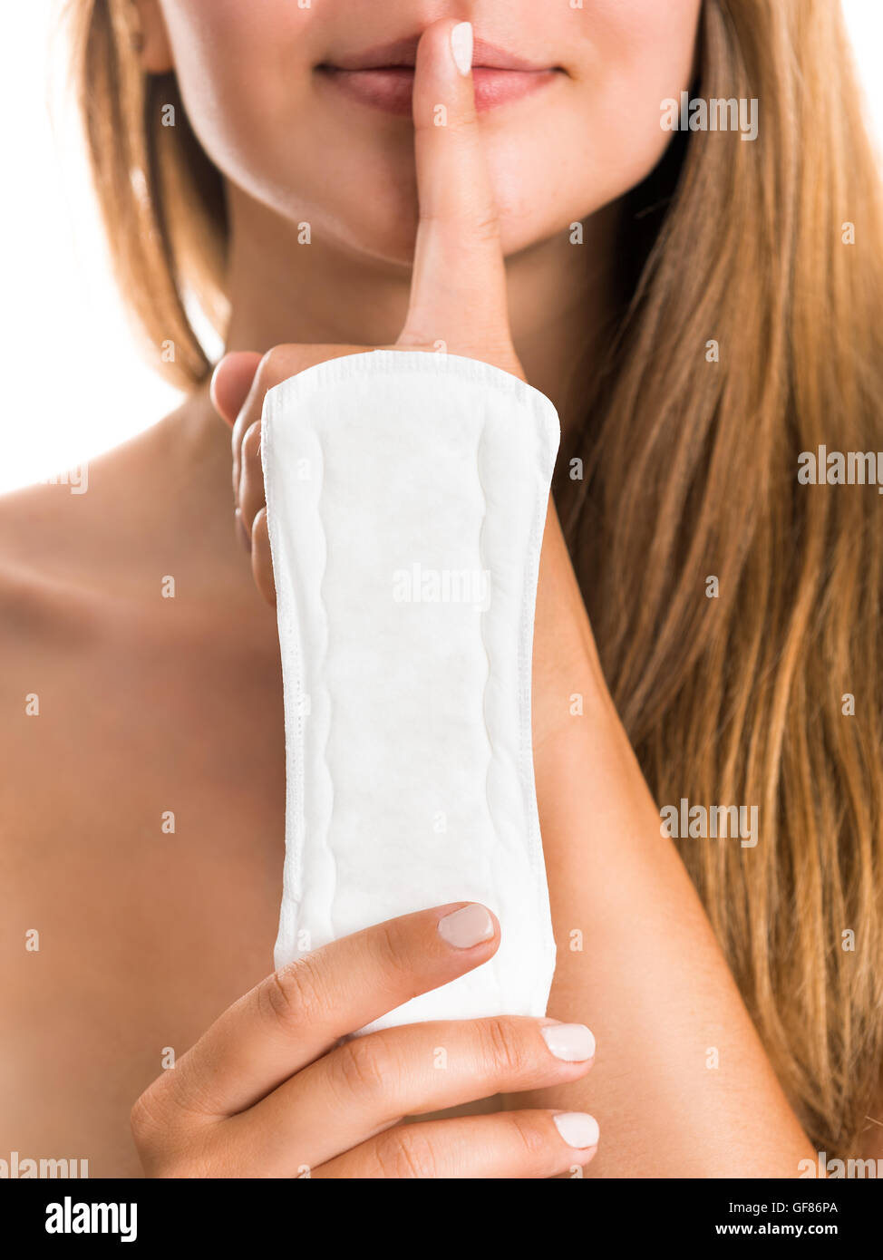 Woman demonstrates the sanitary towel. It is - the secret of her daily freshness Stock Photo