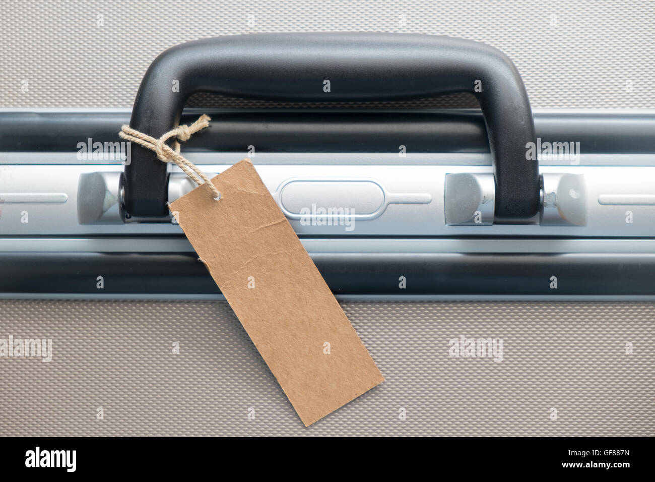 Suitcase with TRAVEL blank luggage tag label or price tag Stock Photo Alamy