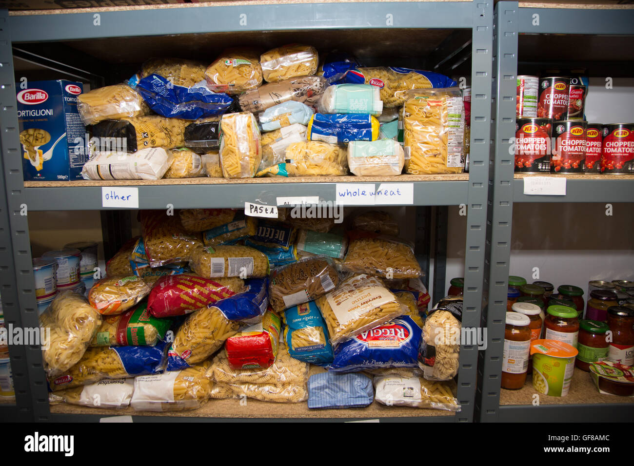 The shelves of a food bank containing dry provisions Stock Photo