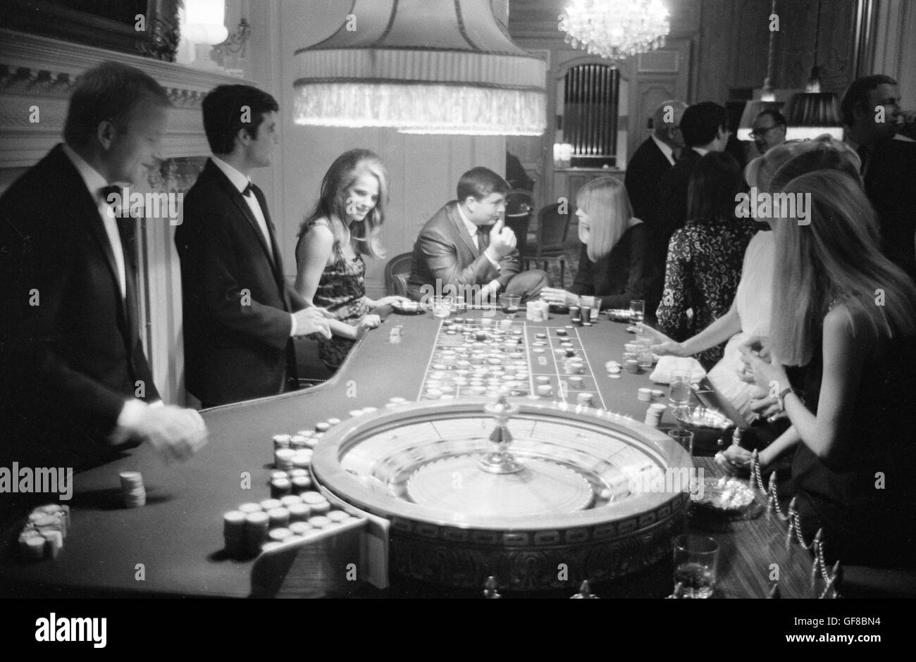 Charlotte Rampling gambling at The Pair of Shoes, a casino in London, 1966 Stock Photo