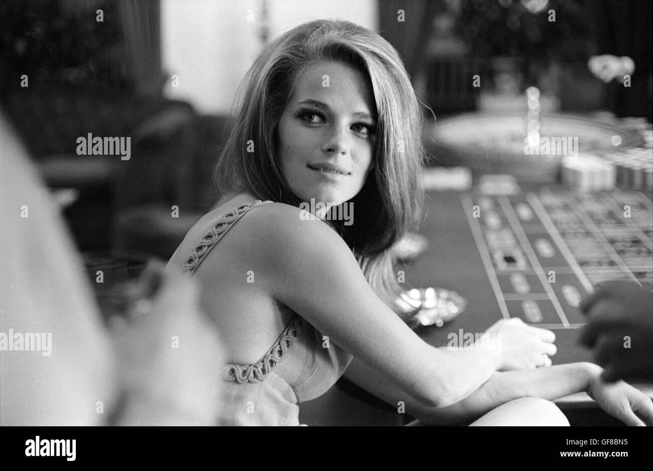 Charlotte Rampling gambling at The Pair of Shoes, a casino in London, 1966 Stock Photo