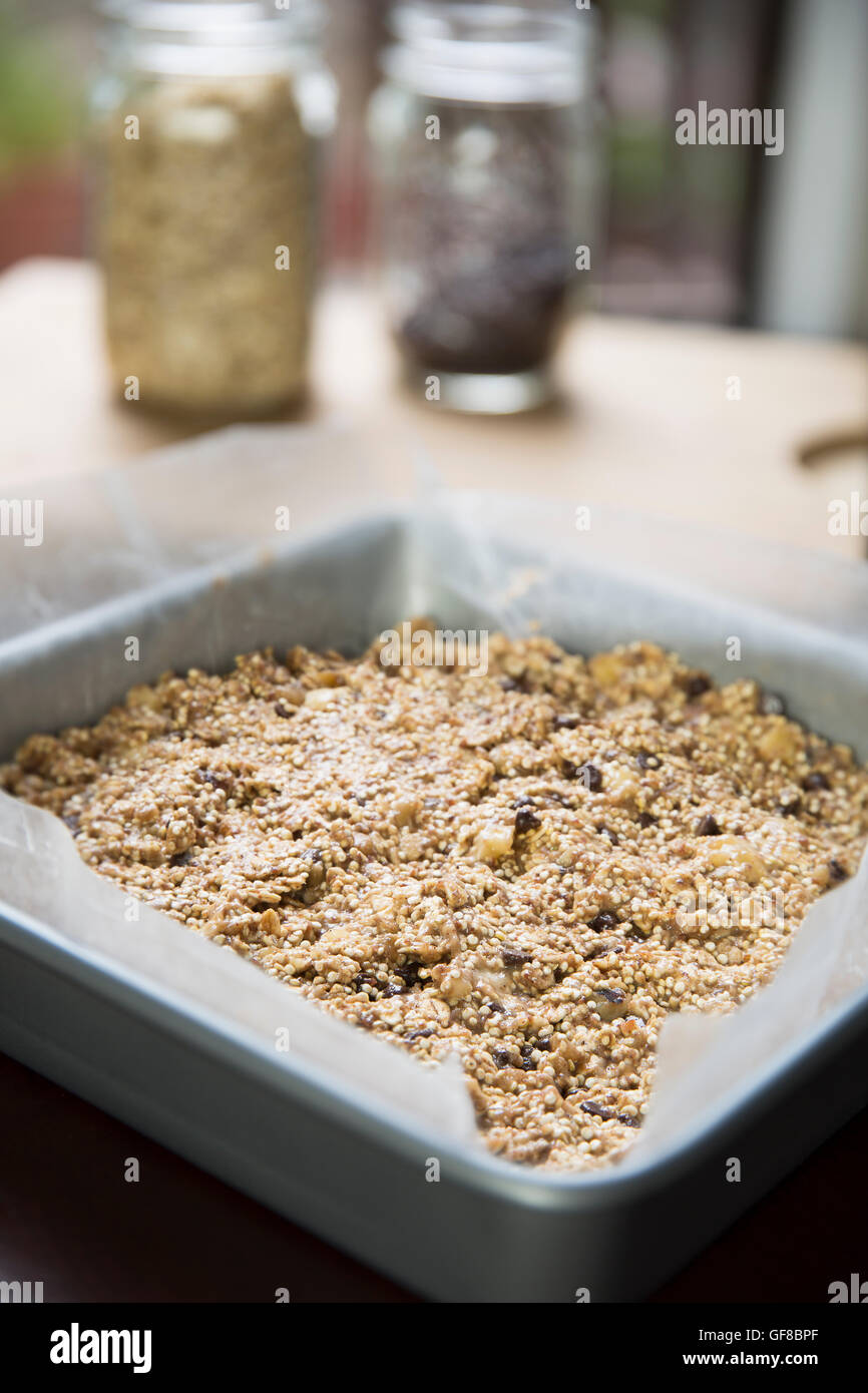 Baking pan full of quinoa and oat bars dough ready for baking Stock Photo