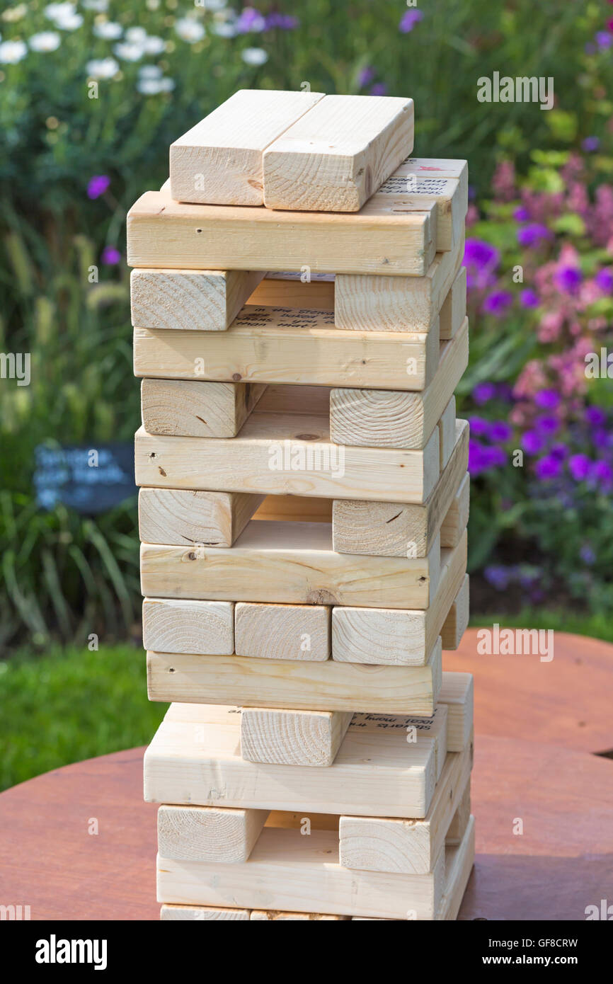Jenga type wooden tower blocks in Stewarts garden display at New Forest & Hampshire County Show, Brockenhurst in July Stock Photo