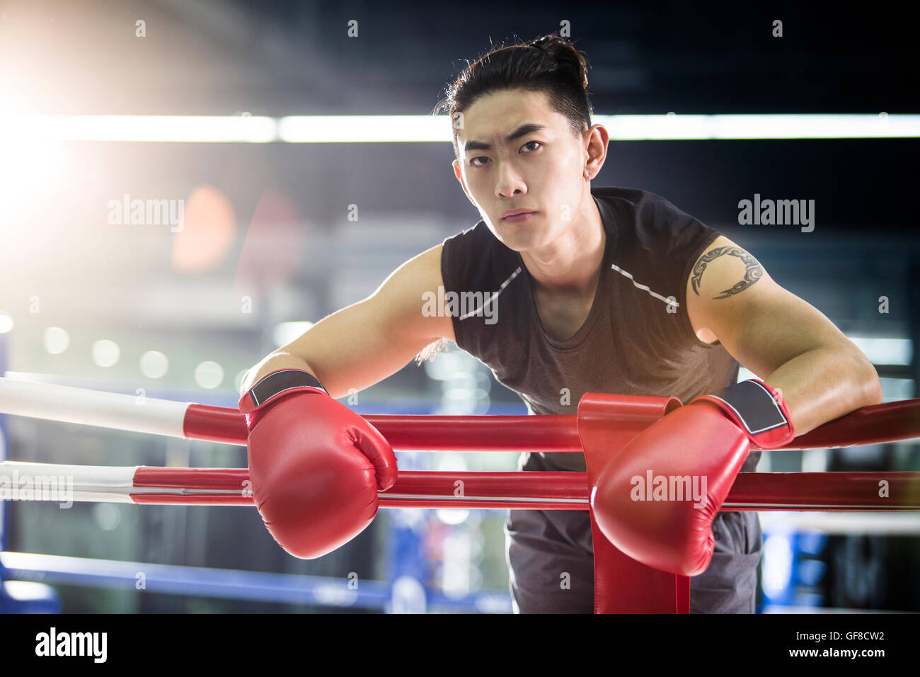 Chinese boxer resting in boxing ring Stock Photo
