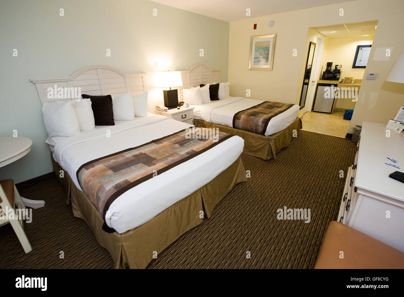 Two double size beds in a hotel room Stock Photo Alamy