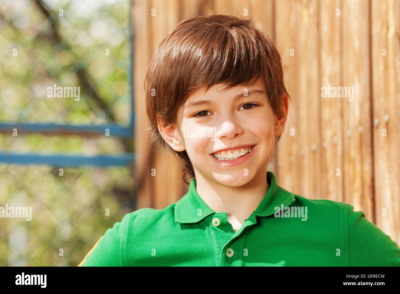 Close-up portrait of smiling dark-haired boy Stock Photo