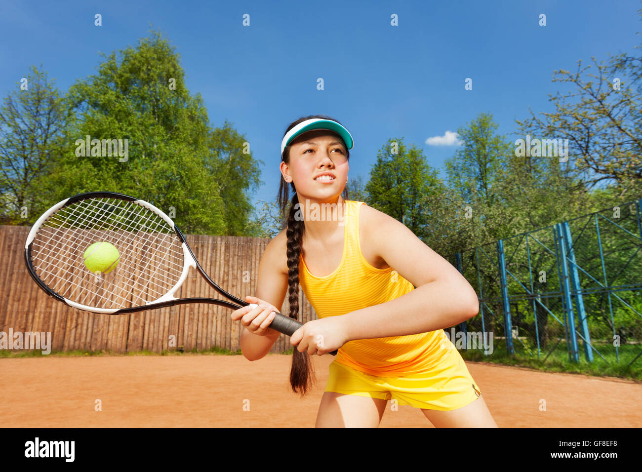 Professional female tennis player in action Stock Photo