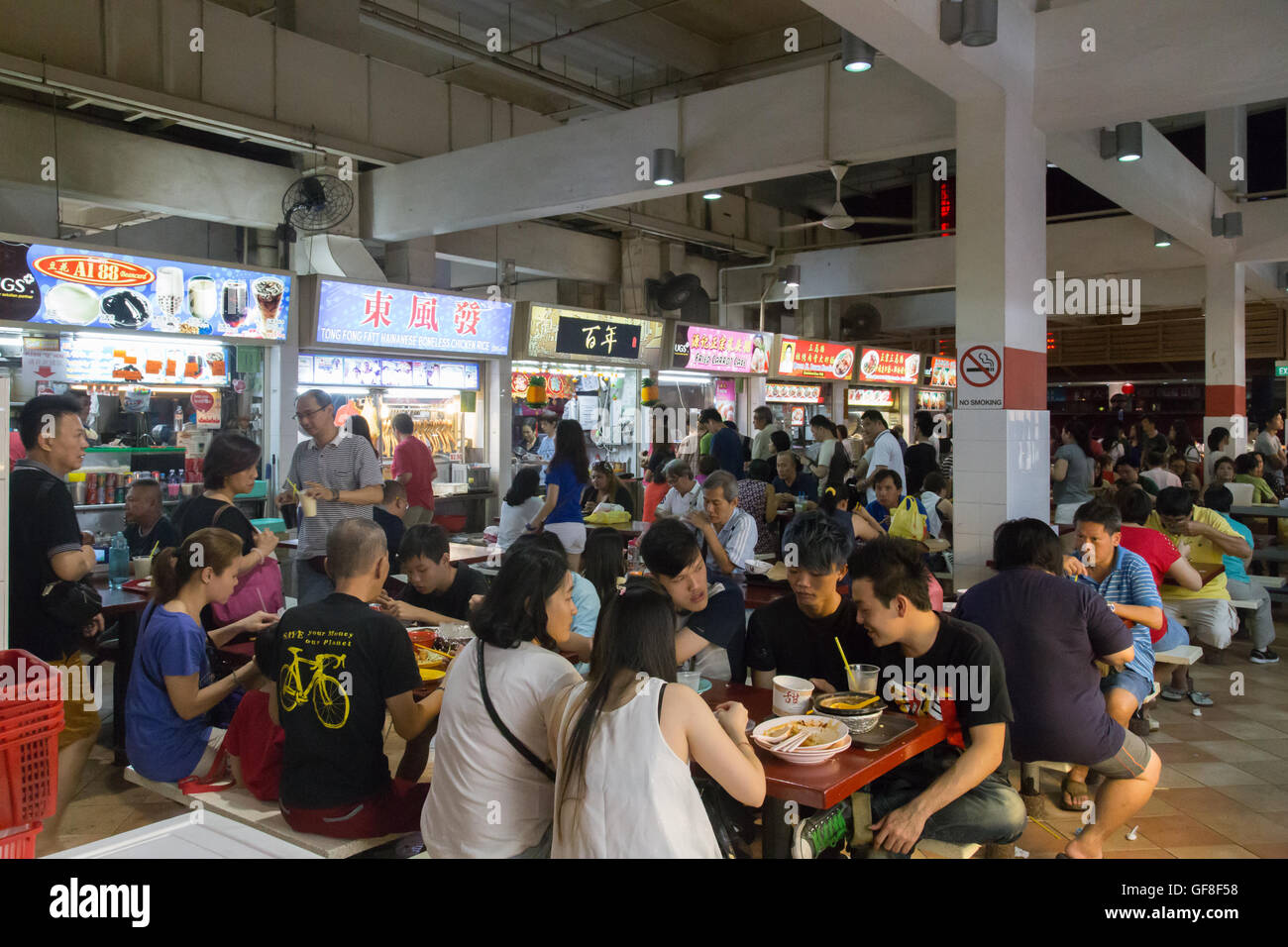 Singapore, Singapore - January 31, 2015: People enjoying food at the Lau Pa Sat foodcourt . Stock Photo
