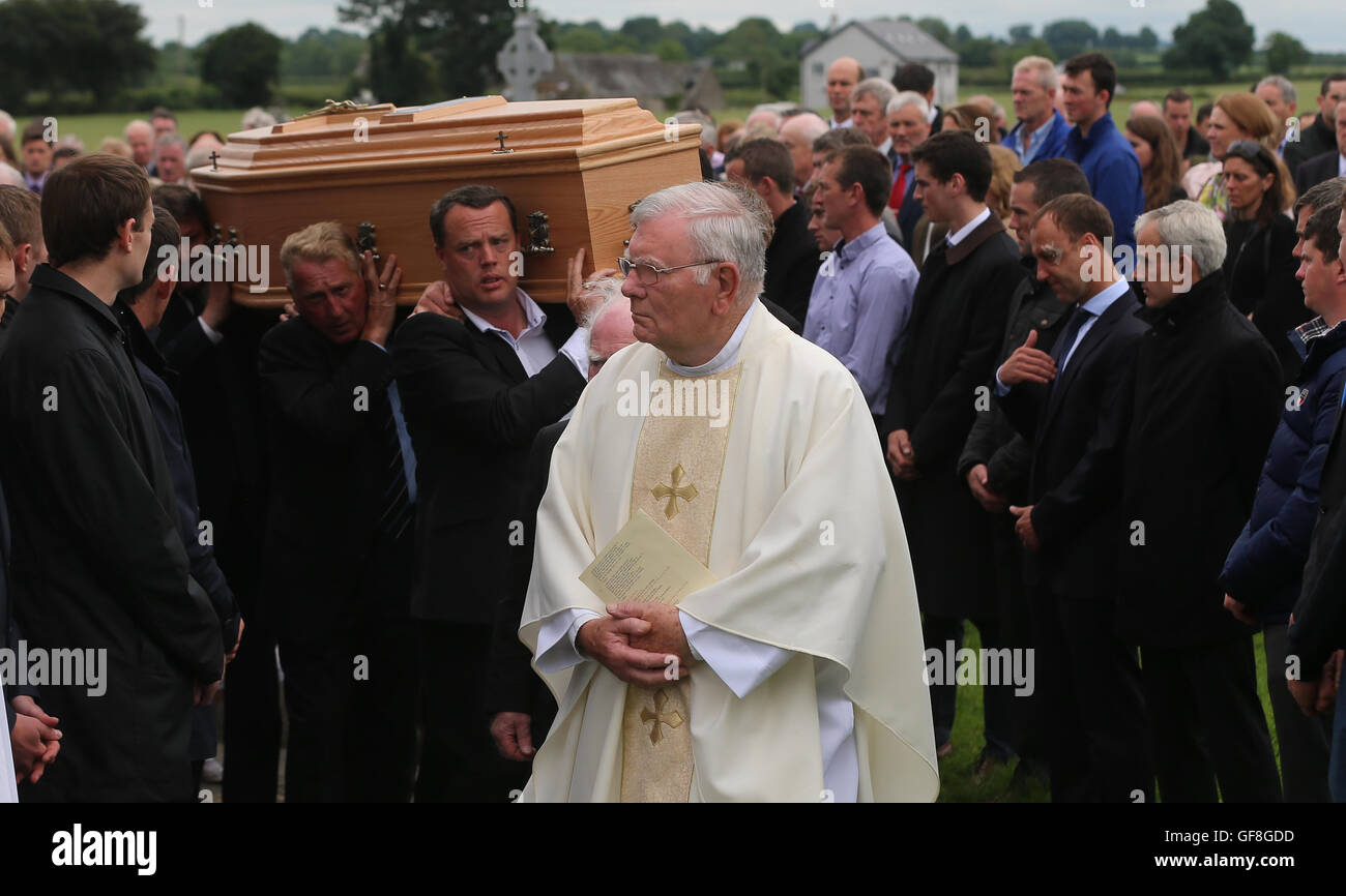 Jockeys form a guard of honor during the funeral of jockey JT McNamara