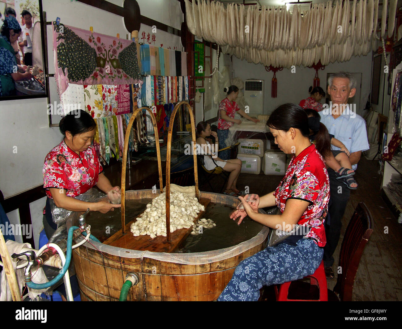 Women working in a silk factory in Ciqikou Ancient Town, a preserved