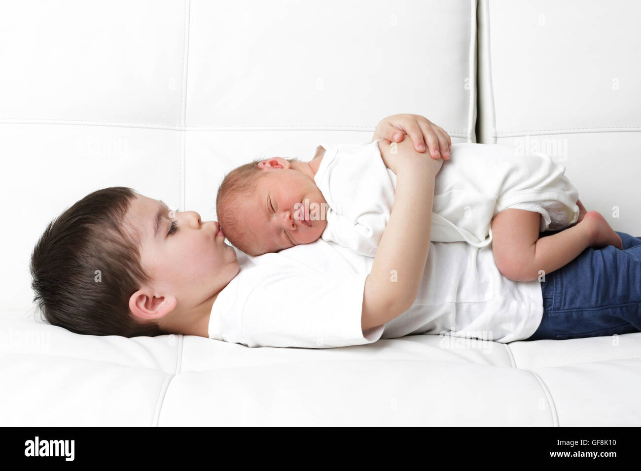 Newborn baby with brother Stock Photo