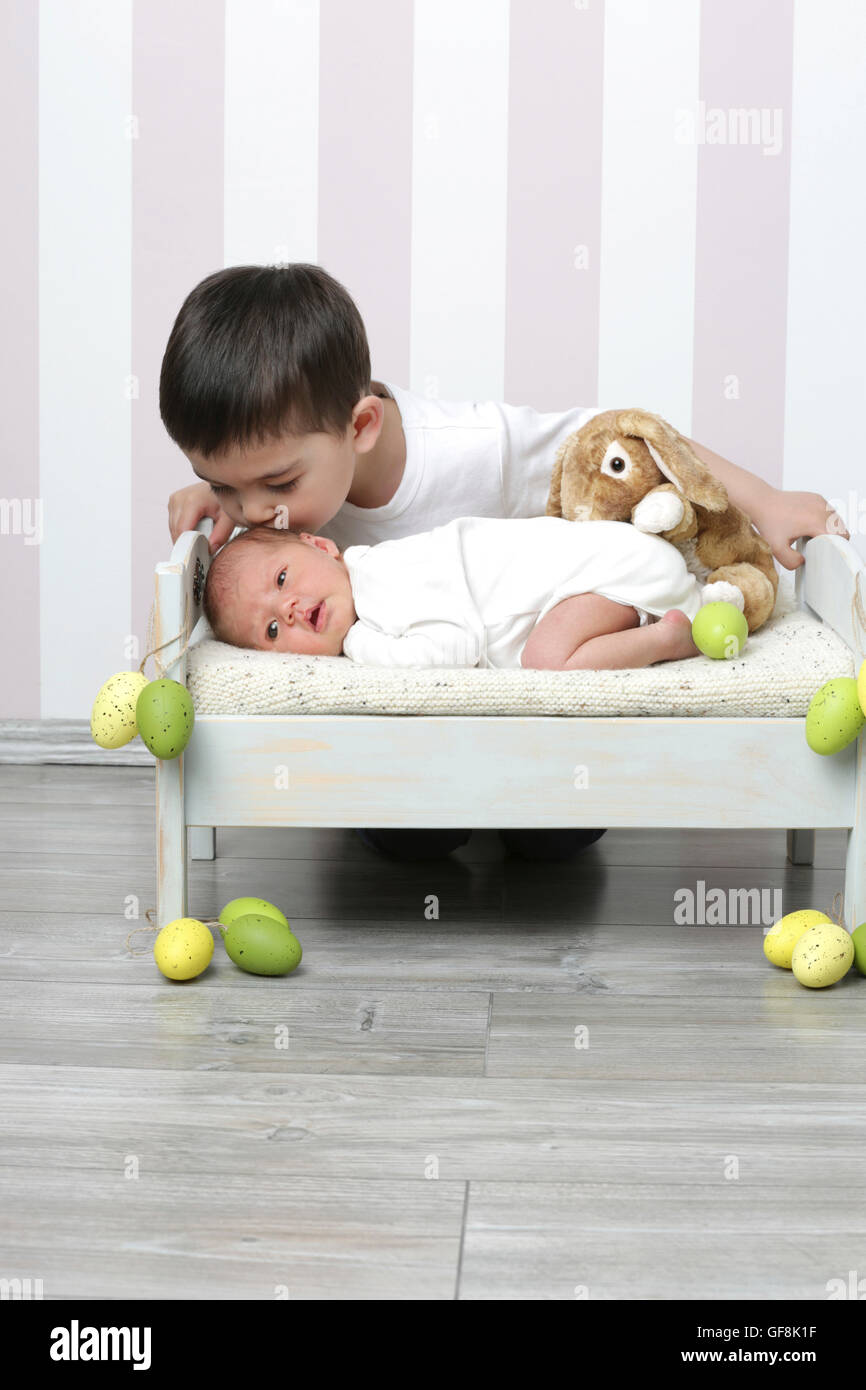 Newborn baby with brother Stock Photo