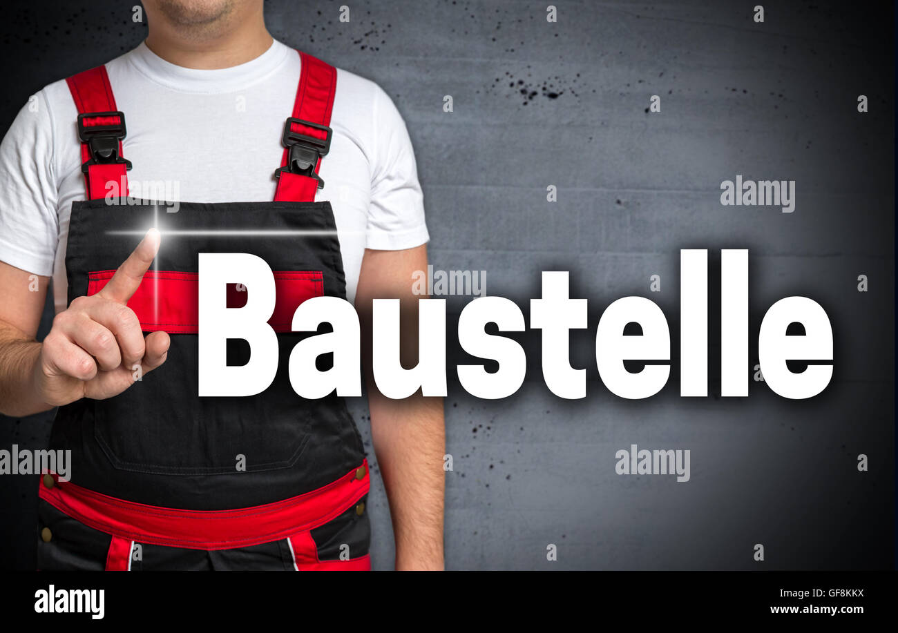 Baustelle (in german Construction) touchscreen is shown by craftsman. Stock Photo