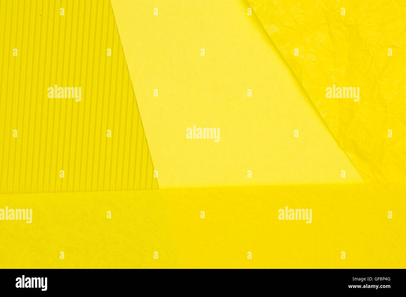 sheets of yellow color paper background texture Stock Photo