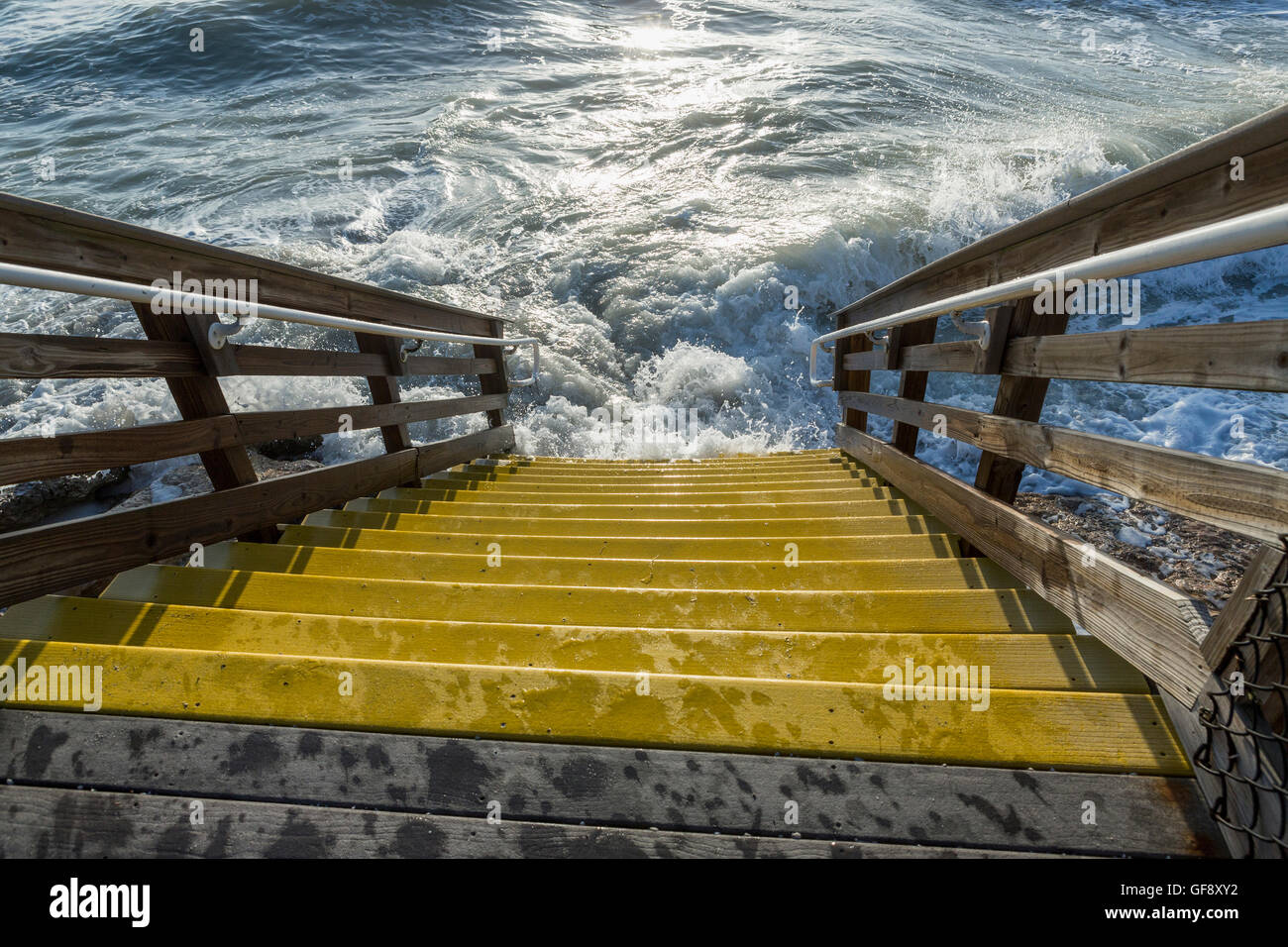 Wooden stairs to the beach flooded stormy sea, FLorida Stock Photo