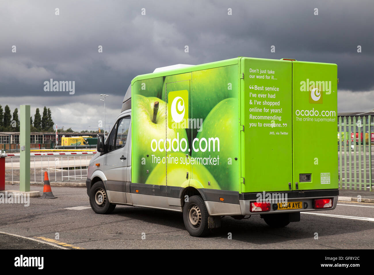 Ocado Apple Van livery & Morrisons supermarket grocery delivery service  food store vehicles; online delivery fleet delivering, groceries &  household essentials in Liverpool, Merseyside, UK Stock Photo - Alamy