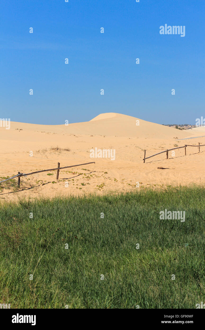 white sand dune and blue sky in mui ne , vietnam Stock Photo