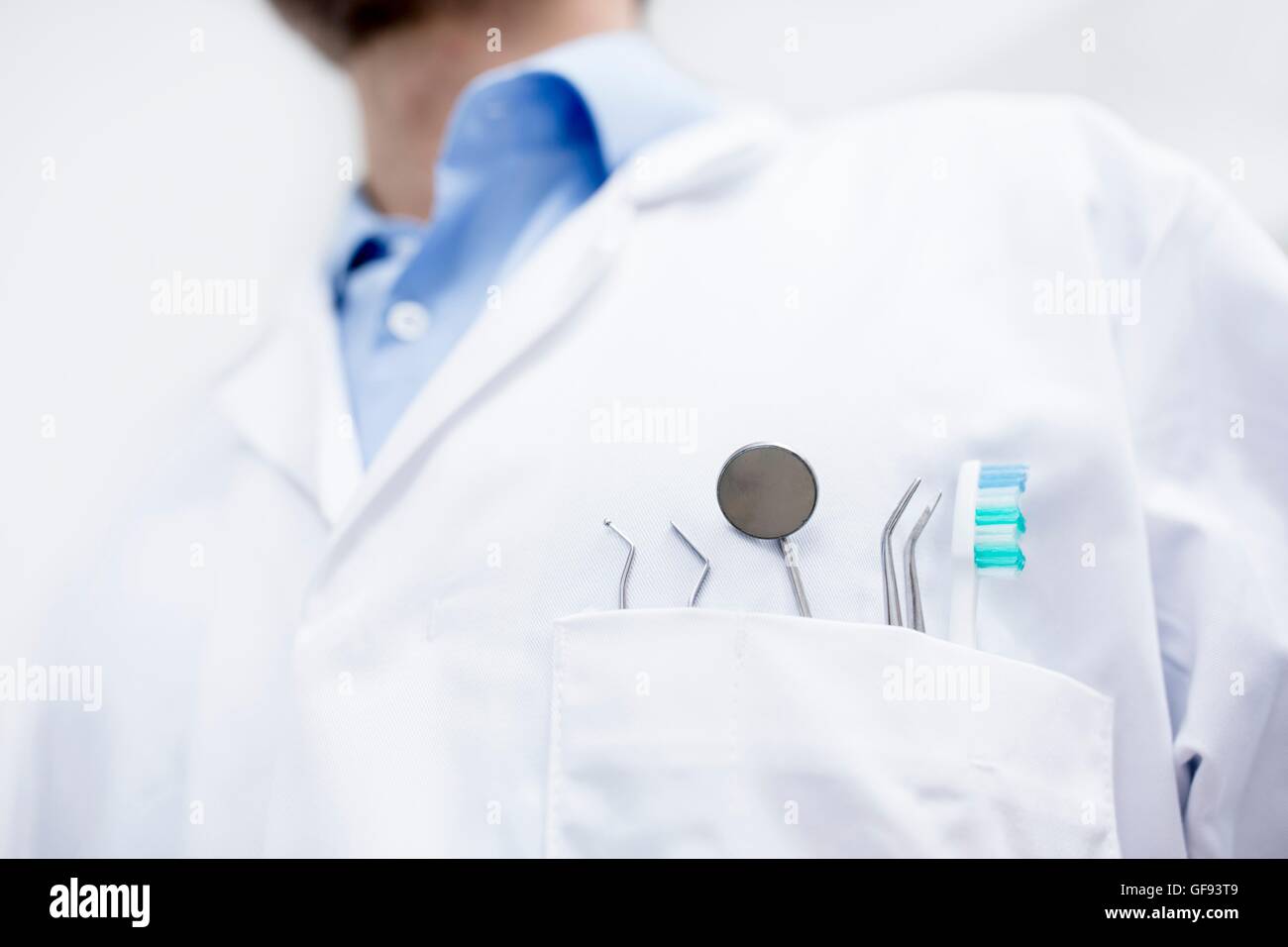 MODEL RELEASED. Close-up of dental equipment in doctor's pocket. Stock Photo