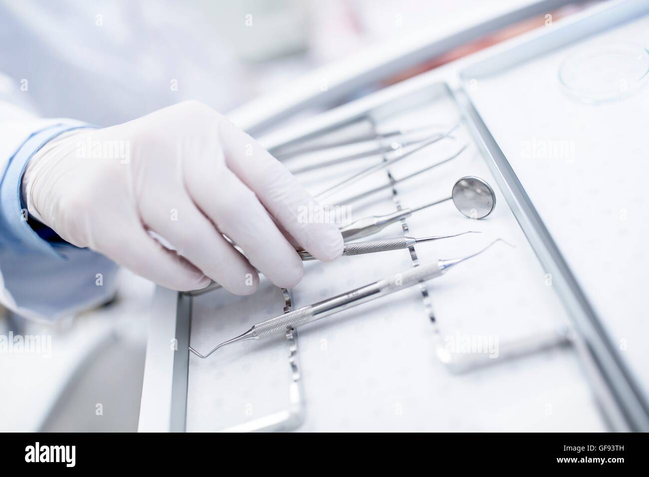 MODEL RELEASED. Close-up of dental equipment in doctor's hand. Stock Photo