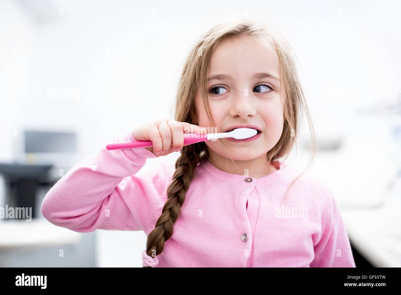 MODEL RELEASED. Girl brushing teeth, close-up. Stock Photo