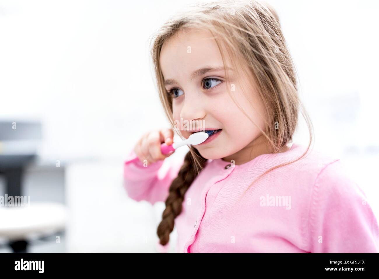 MODEL RELEASED. Girl brushing teeth, close-up. Stock Photo