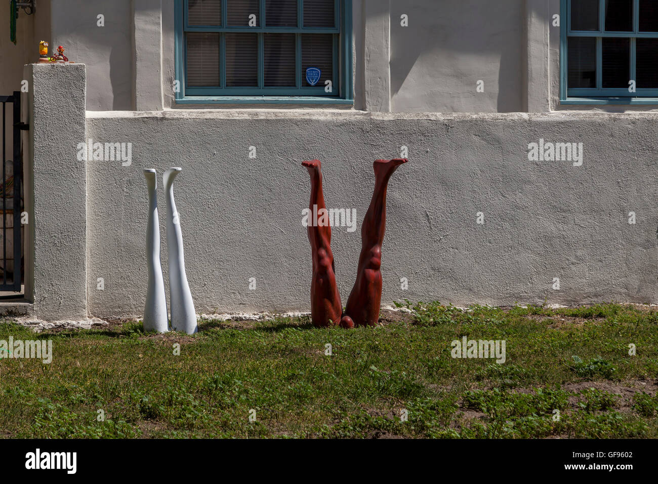 Sculptures of female and male legs in a garden, Venice Beach, California, USA. Stock Photo