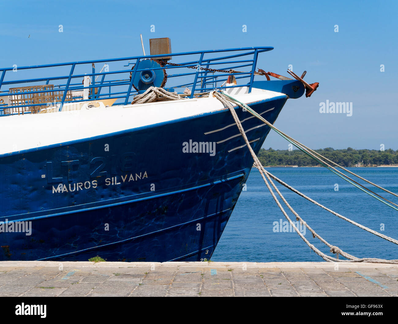 Europe Croatia Istria city of Pula port harbour ship pier blue fastened ropes Stock Photo