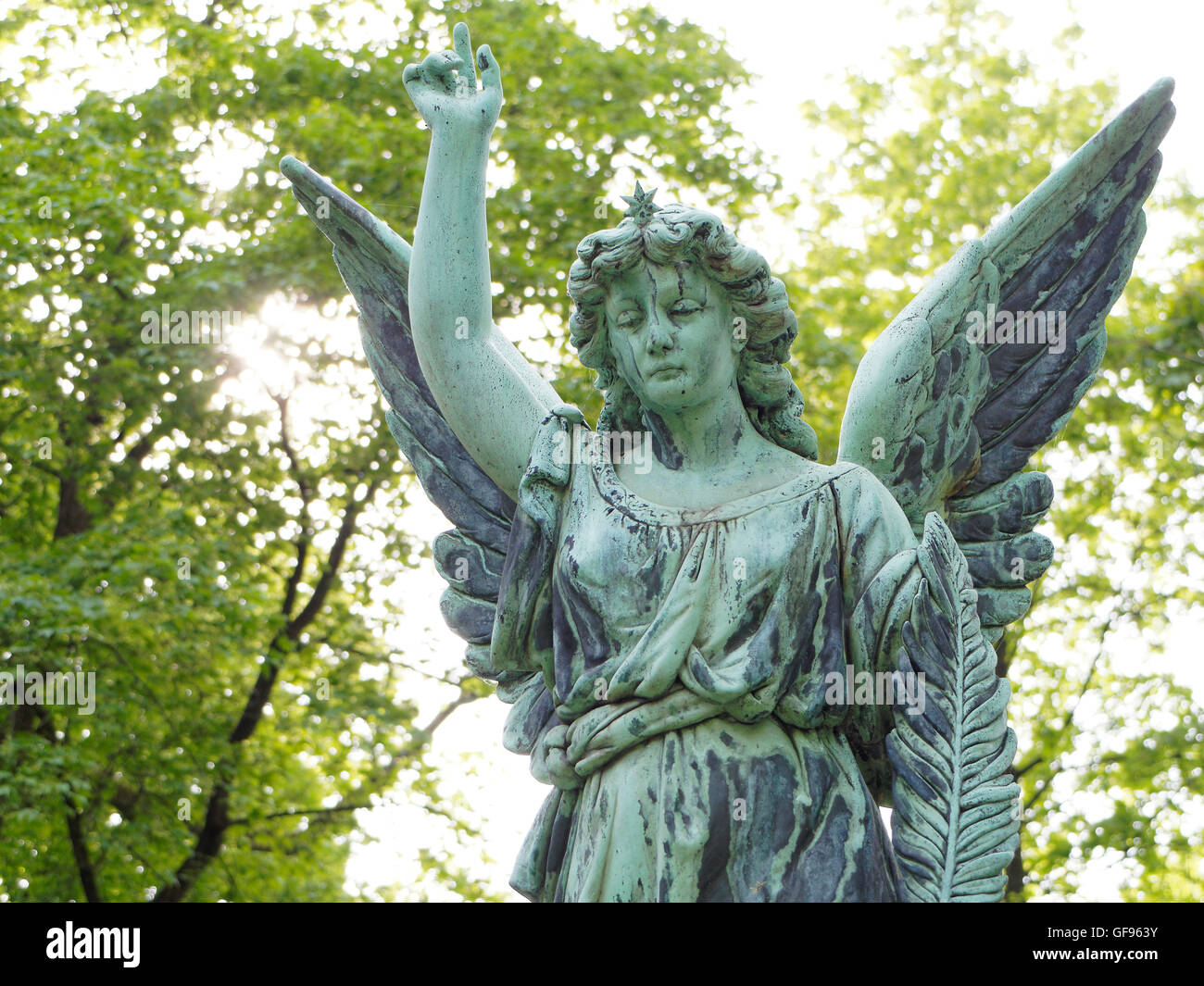 Europe Bavaria City of Munich cemetery Ostfriedhof sculpture metal bronze green oxidation angel symbol mourning old historical Stock Photo