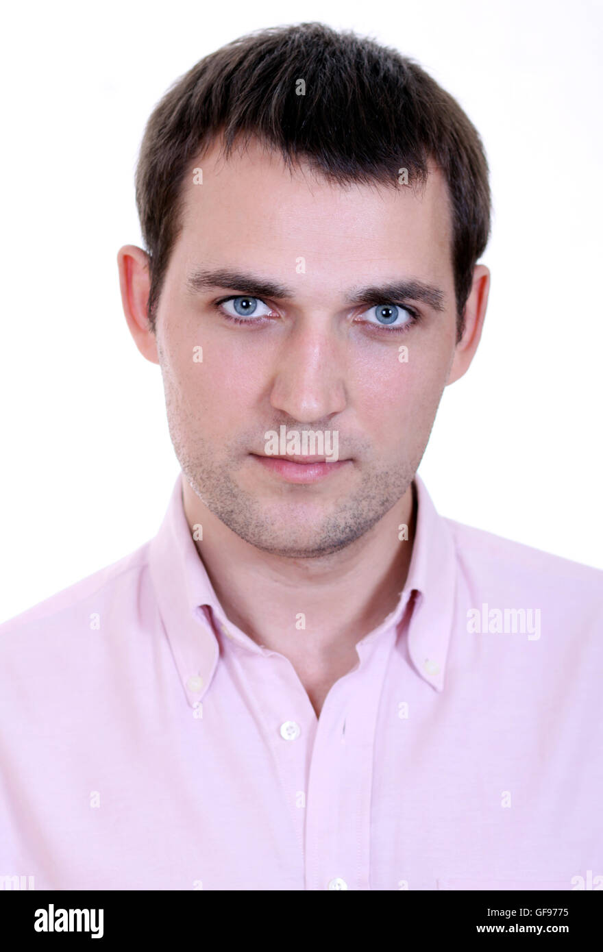 Portrait of a happy young man standing against white background Stock ...
