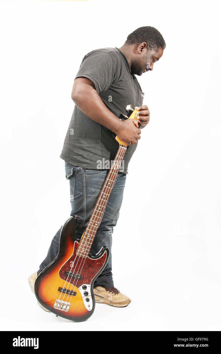 an american african bass player on white background Stock Photo