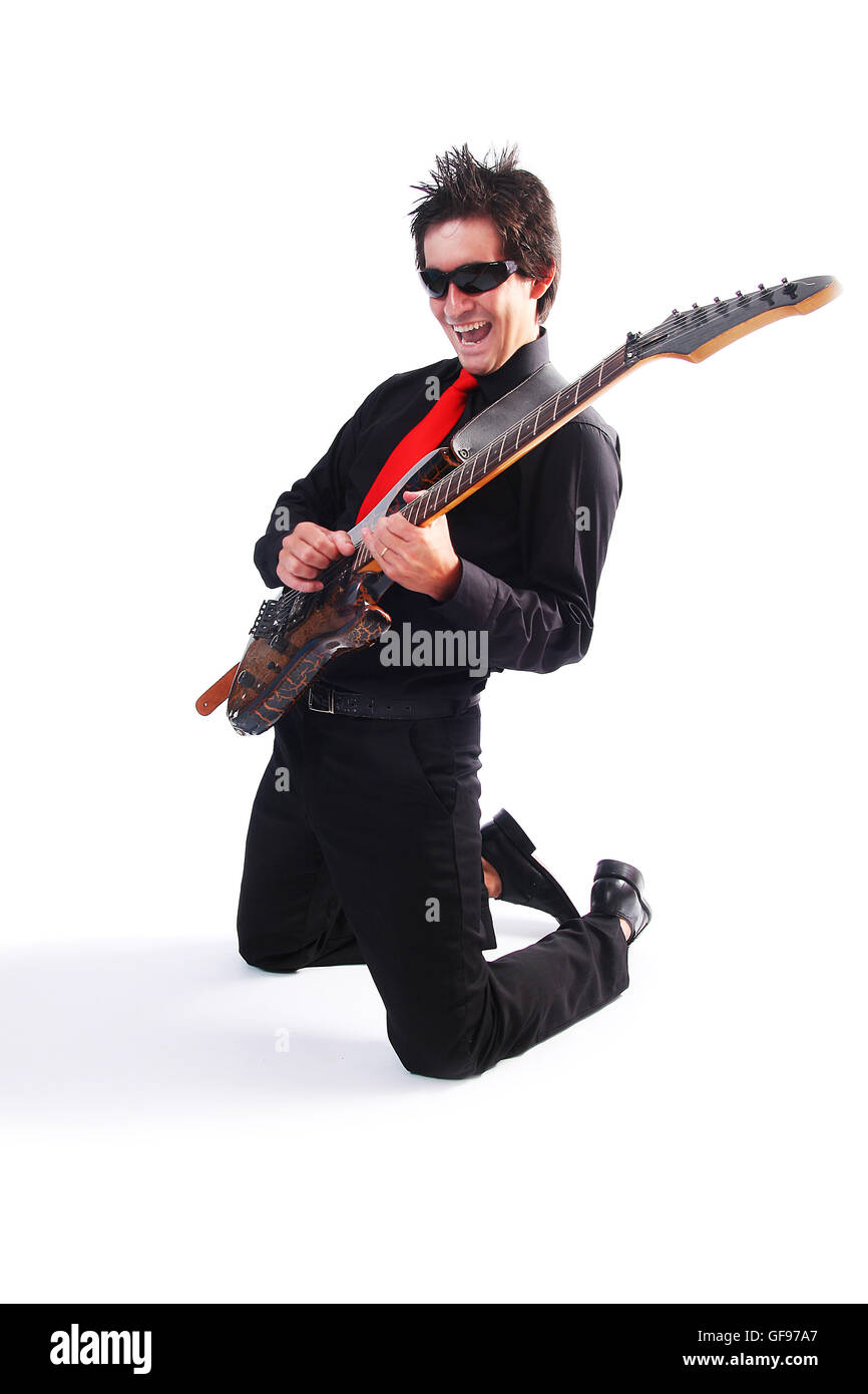 A male guitarrist in action in white background Stock Photo