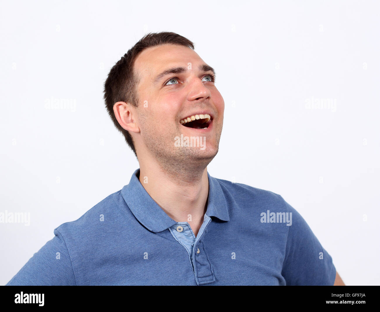 Portrait of a happy young man standing against white background Stock ...