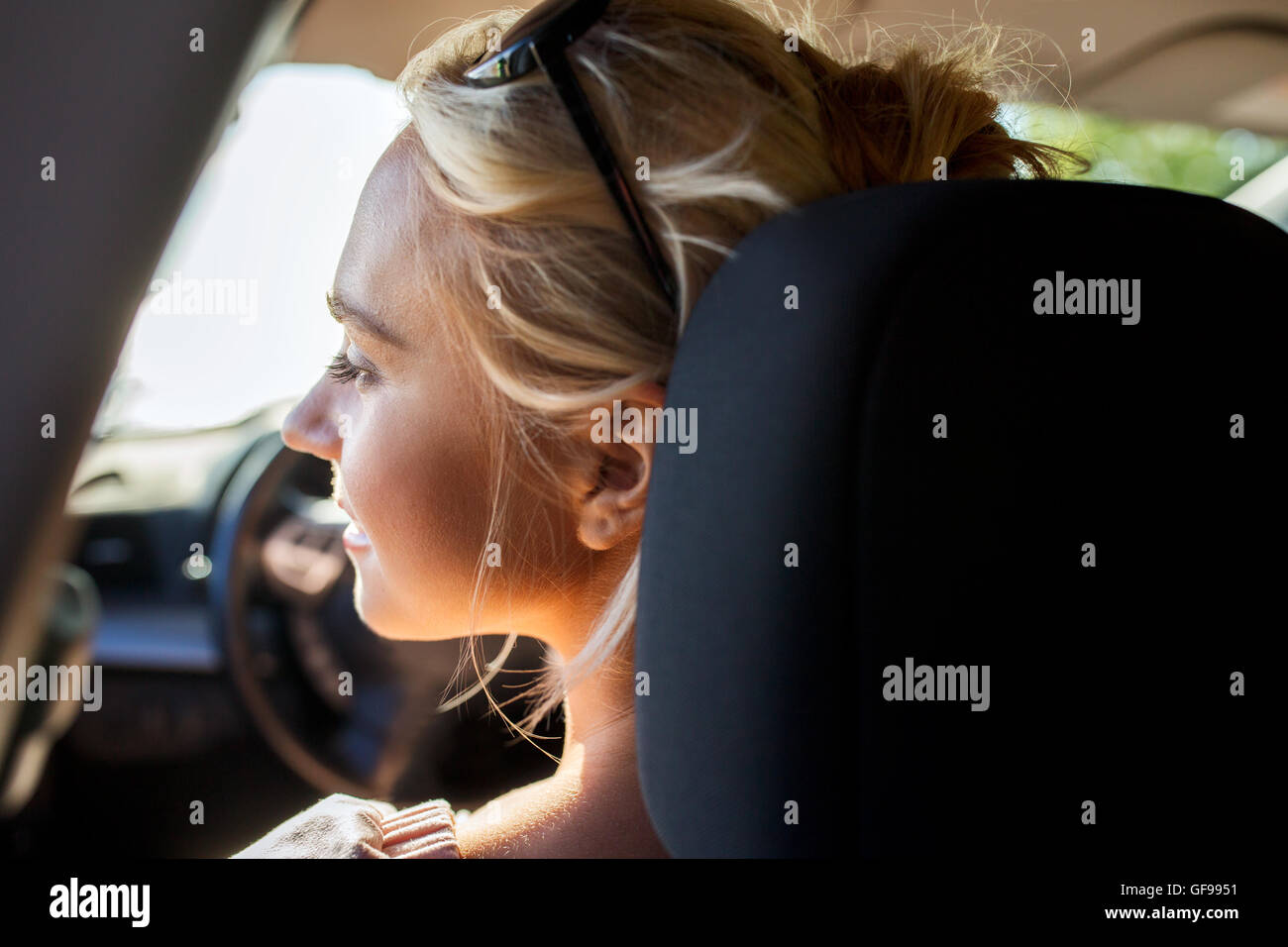 happy teenage girl or young woman in car Stock Photo - Alamy