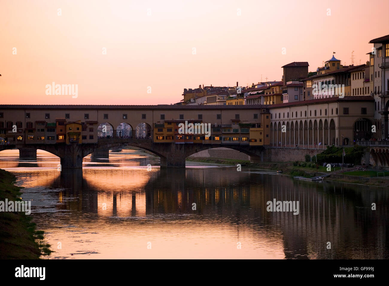 Dusk over the river Arno in Florence, Tuscany, Italy, with the Ponte Vecchio spanning the river: from Ponte alle Grazie Stock Photo
