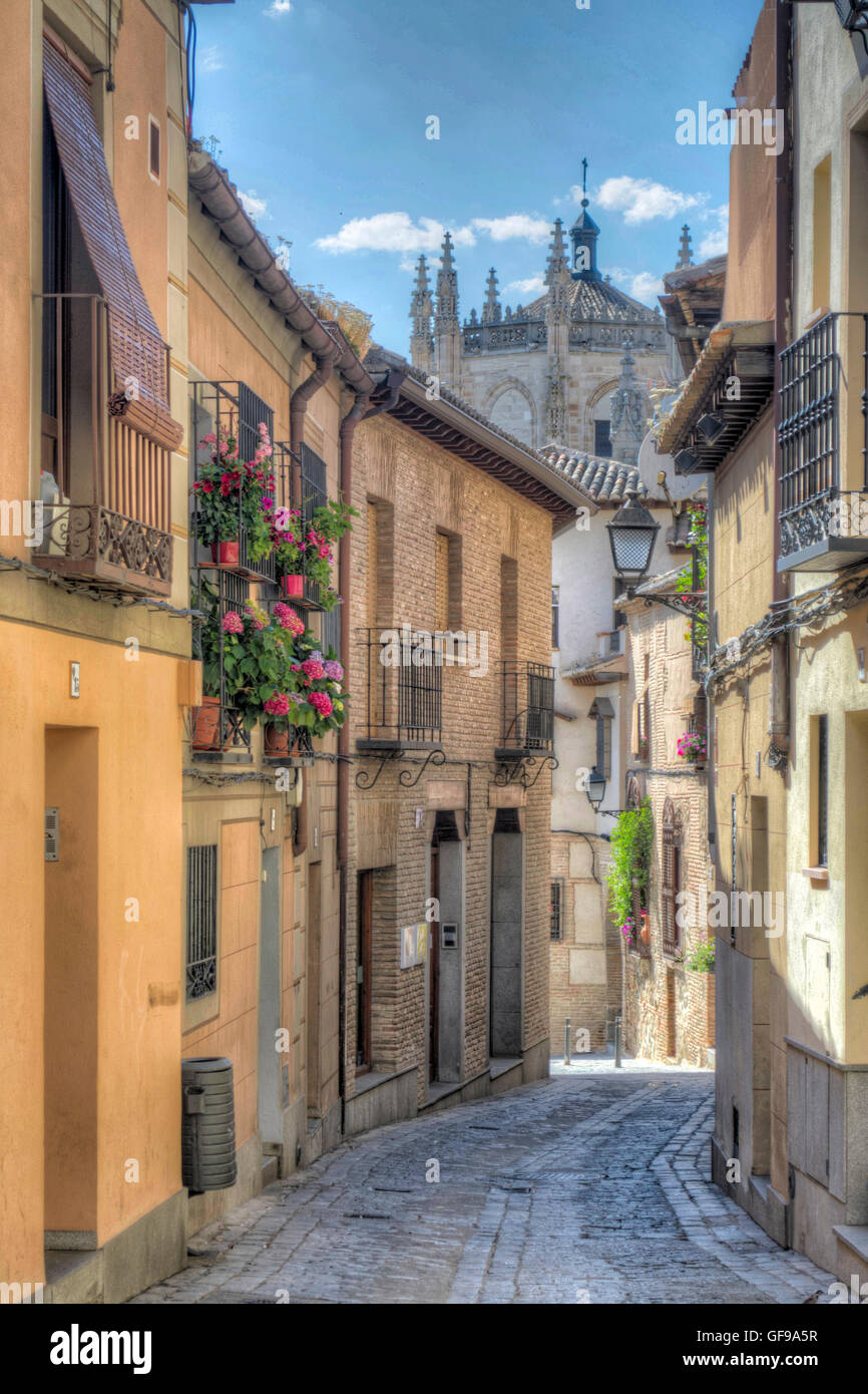 HDR image of a traditional cobbled narrow street in Toledo leading to the Cathedral, Toledo, Spain Stock Photo